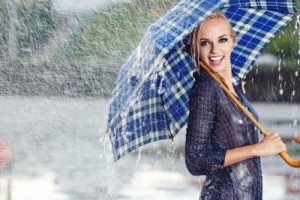 14657879-sexy-girl-under-umbrella-watching-the-rain